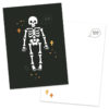 Zwarte postkaart met een wit skelet en witte envelop van het merk Pinkstore